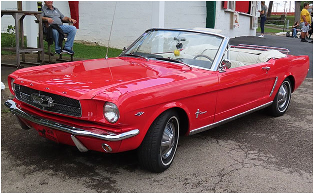 A red convertible carDescription automatically generated with medium confidence